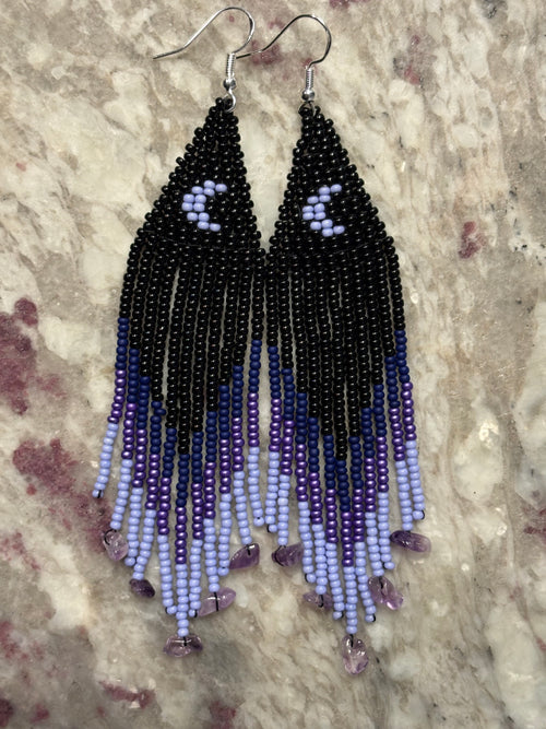 Purple Rain beaded fringe earrings on marble surface