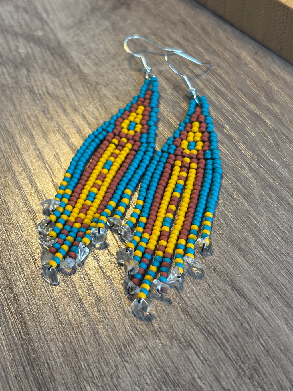 Quartz Mine beaded fringe earrings angled view on wood surface