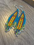 Quartz Mine beaded fringe earrings angled view on wood surface